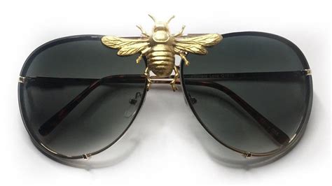 gucci glasses with bee in the middle